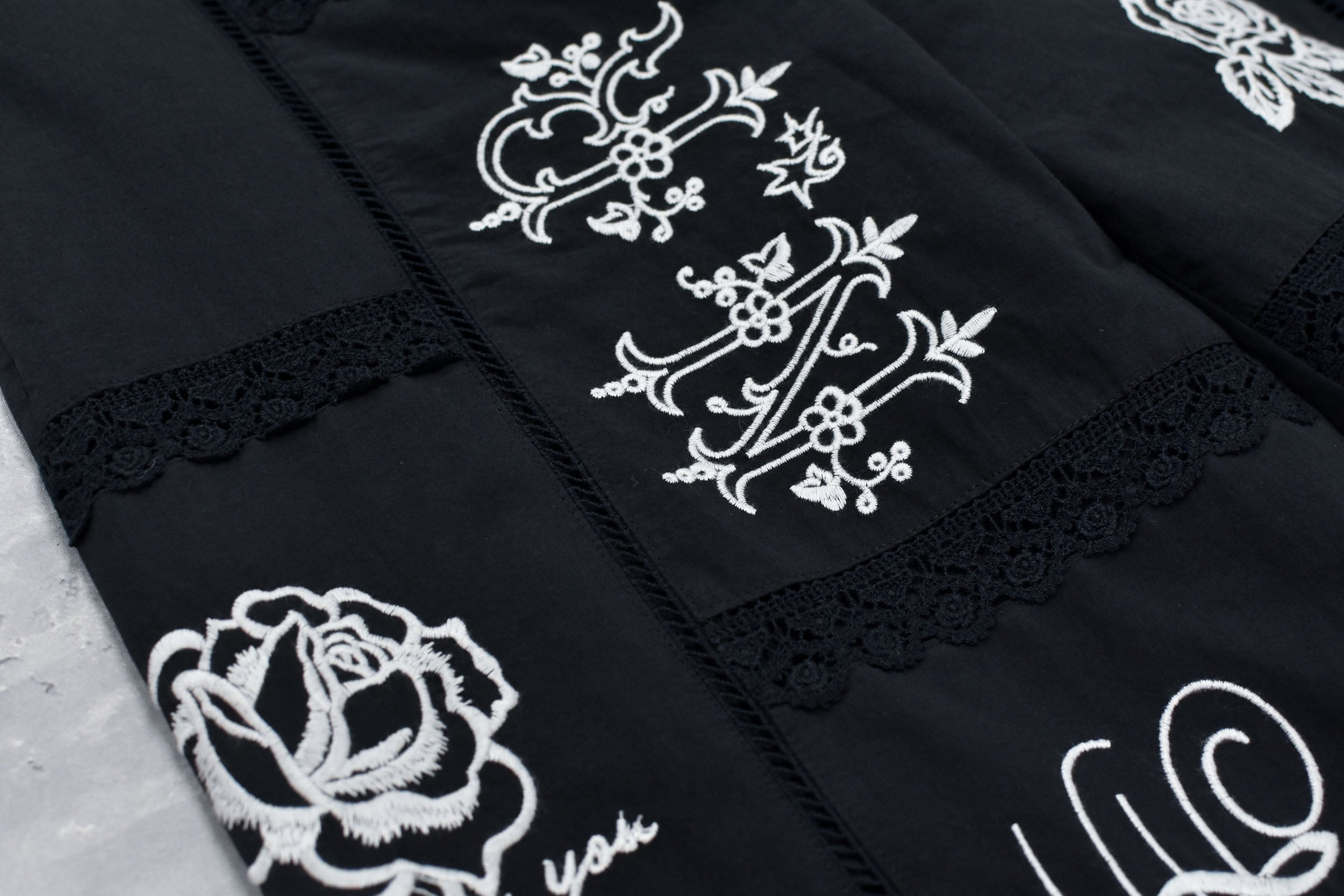 Ladder Race×Embroidery Pants